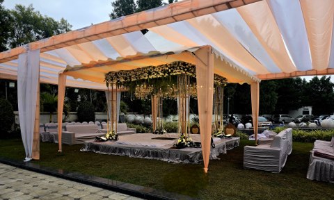 Open lawn with a canopy mandap set up for a daytime function at Jaithri Grand Convention, Hyderabad